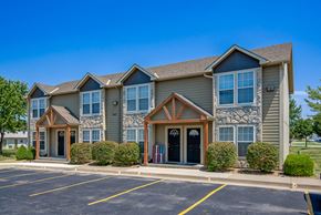 Gardner apartment for rent - the exterior of a building with a parking lot