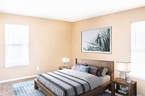 Lee's Summit apartment for rent - a bedroom with a bed and two windows