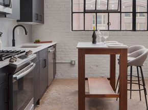Philadelphia apartment for rent - a kitchen with a table and chairs and a stove and a sink