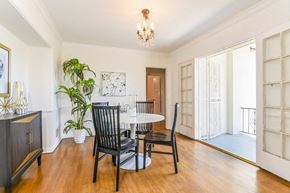 Los Angeles apartment for rent - a dining room with a table and chairs and a chandelier