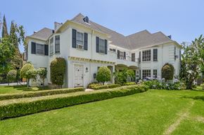 Los Angeles apartment for rent - a large white house with a lawn in front of it