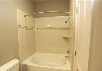Large soaking tub in bathroom
