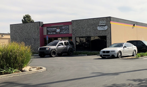 Santa Ana apartment for rent - a dealership with cars parked in front of it