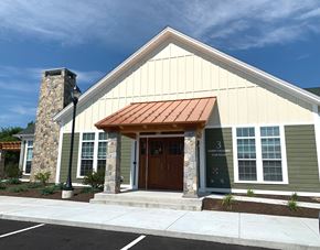 Merrimack apartment for rent - the front of a clubhouse building with a brown door
