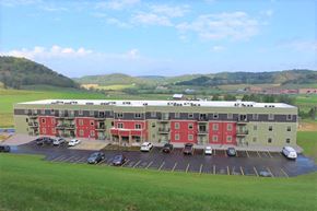 Richland Center apartment for rent - an aerial view of an apartment building with cars in a parking lot