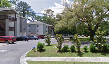 Tallahassee apartment for rent - a city street with houses and trees and a fire hydrant
