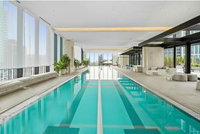 Chicago apartment for rent - A long rectangular swimming pool in a spacious room.