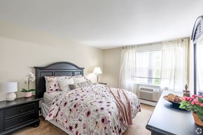 Rocky Hill apartment for rent - a bedroom with a bed and a dresser and a window
