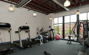 Baltimore apartment for rent - a gym with exercise equipment and a window