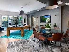 Anaheim apartment for rent - A modern dining room with a glass table and chairs.