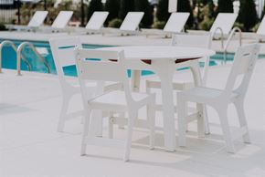 Willoughby apartment for rent - a white table and chairs next to a pool