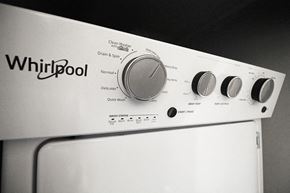Oak Park apartment for rent - a white whirlpool oven with four different knobs on it