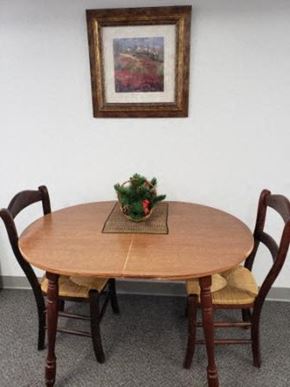 Portage apartment for rent - a dining room table with chairs and a centerpiece