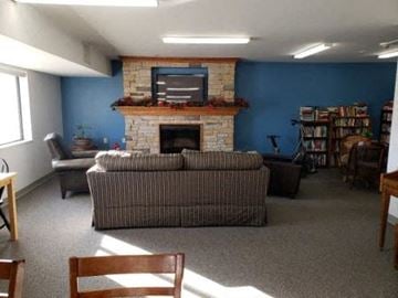 Portage apartment for rent - a living room with a couch and a fireplace