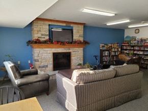 Portage apartment for rent - a living room with a fireplace and a couch