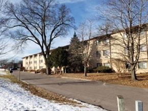 Portage apartment for rent - an apartment building on a street in the snow