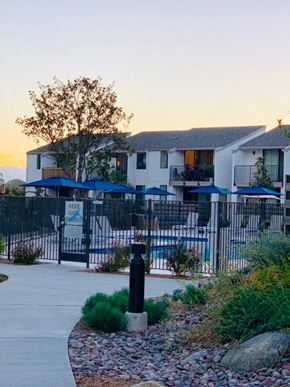 Solana Beach apartment for rent - an apartment building with a pool and a gate