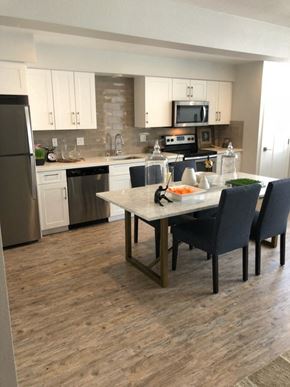 Solana Beach apartment for rent - an open kitchen and dining area with a table and chairs