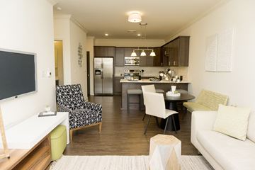 Latham apartment for rent - a living room and kitchen with a table and chairs