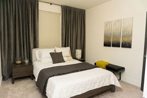 Latham apartment for rent - a bedroom with a bed and a window with curtains