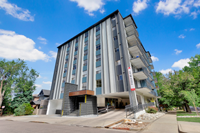 Denver apartment for rent - a tall building with a blue sky in the background