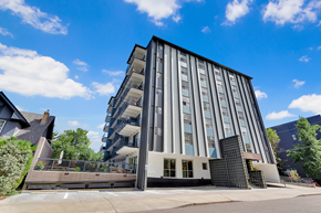 Denver apartment for rent - a large apartment building with a staircase and a blue sky