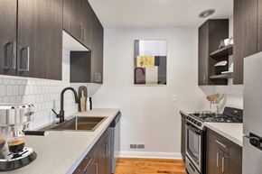 Denver apartment for rent - a kitchen with a sink and a stove and a window