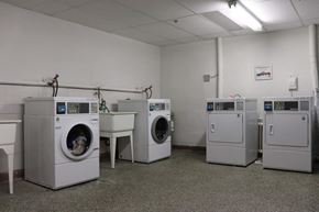 Toronto apartment for rent - a group of washing machines in a room with other washing machines