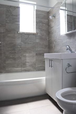 Toronto apartment for rent - a bathroom with a toilet and a sink and a bath tub