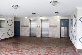 Scarborough apartment for rent - a large room with four elevators and a tile floor