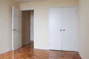 Scarborough apartment for rent - an empty room with a closet and a door