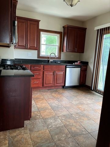 Lakewood house for rent - a kitchen with wooden cabinets and a stove and a sink