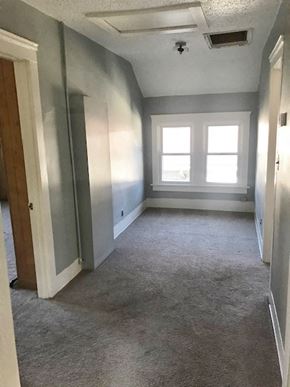 Berea triplex for rent - a empty room with a carpeted floor and a window
