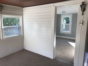 Berea triplex for rent - a small room with a door and a window