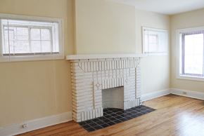 Cleveland Heights apartment for rent - an empty living room with a fireplace and a window