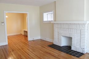 Cleveland Heights apartment for rent - a living room with a fireplace and a wooden floor