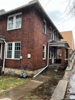 Homestead apartment for rent - the front of a brick house with a porch