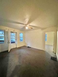 Homestead apartment for rent - an empty living room with a ceiling fan