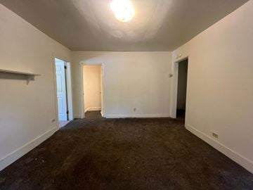 Homestead apartment for rent - a living room with a carpet and white walls