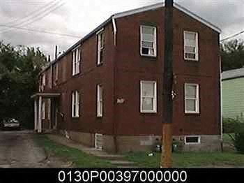 Homestead apartment for rent - a large red brick building with windows on it
