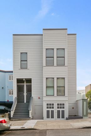 San Francisco apartment for rent - the front of a white house with stairs and a door