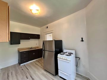 Homestead apartment for rent - A kitchen with a stove and refrigerator.