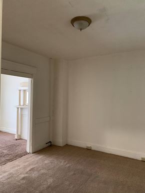 Munhall apartment for rent - a living room with white walls and a ceiling light