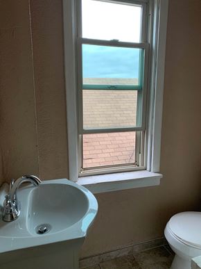 Munhall apartment for rent - a bathroom with a sink and a window