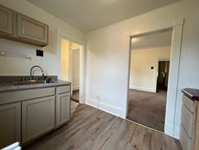 Homestead house for rent - a kitchen with a sink and a mirror in a house