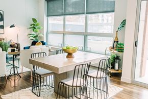 St. Louis apartment for rent - a dining room with a table and chairs and a large window