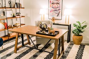 St. Louis apartment for rent - a living room with a wooden table and a rug