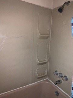 Homestead apartment for rent - a bathroom with a shower and a tub and a window