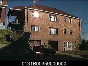 Homestead apartment for rent - a car is parked in front of a brick building