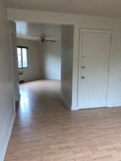Homestead apartment for rent - an empty living room with white walls and a wood floor